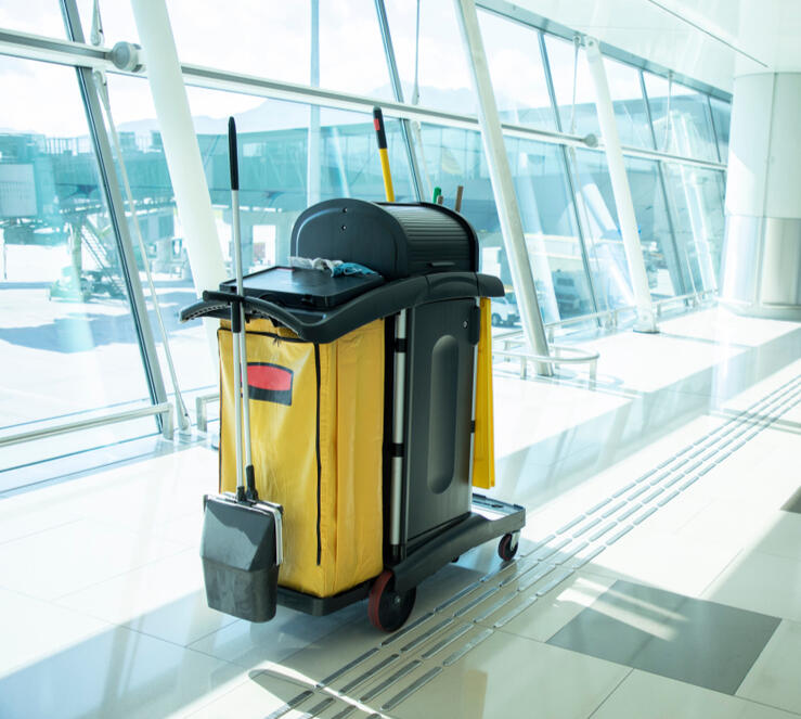 Office Cleaning Services Professional cleaners wiping down desks and sanitizing a workspace.